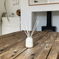 ceramic reed diffuser in dining room 